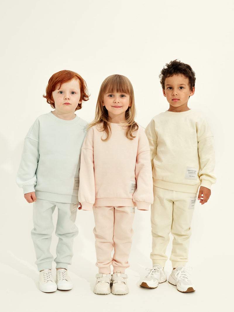 Superpower-collegehousut, pale yellow