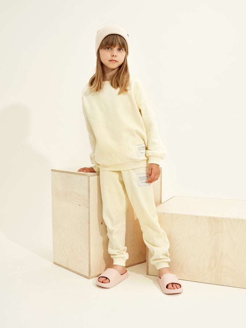 Superpower-collegehousut, pale yellow